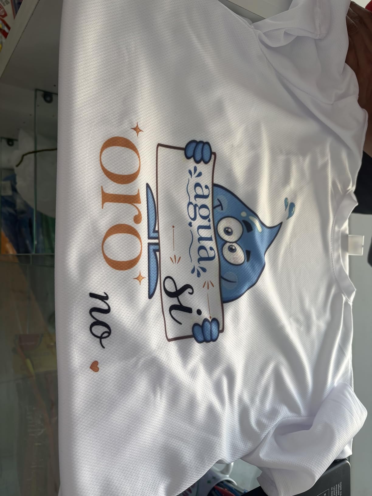 Finished white shirt with a colorful printed character design