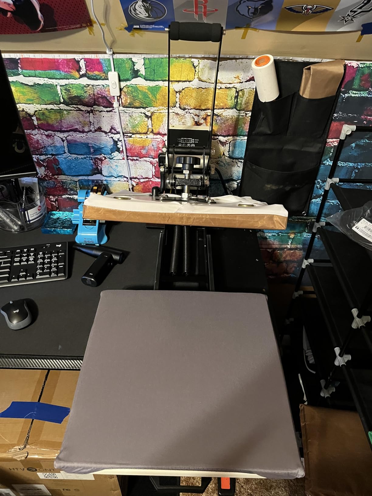 ColorSub heat press installed on a compact home production workbench with its lower drawer extended