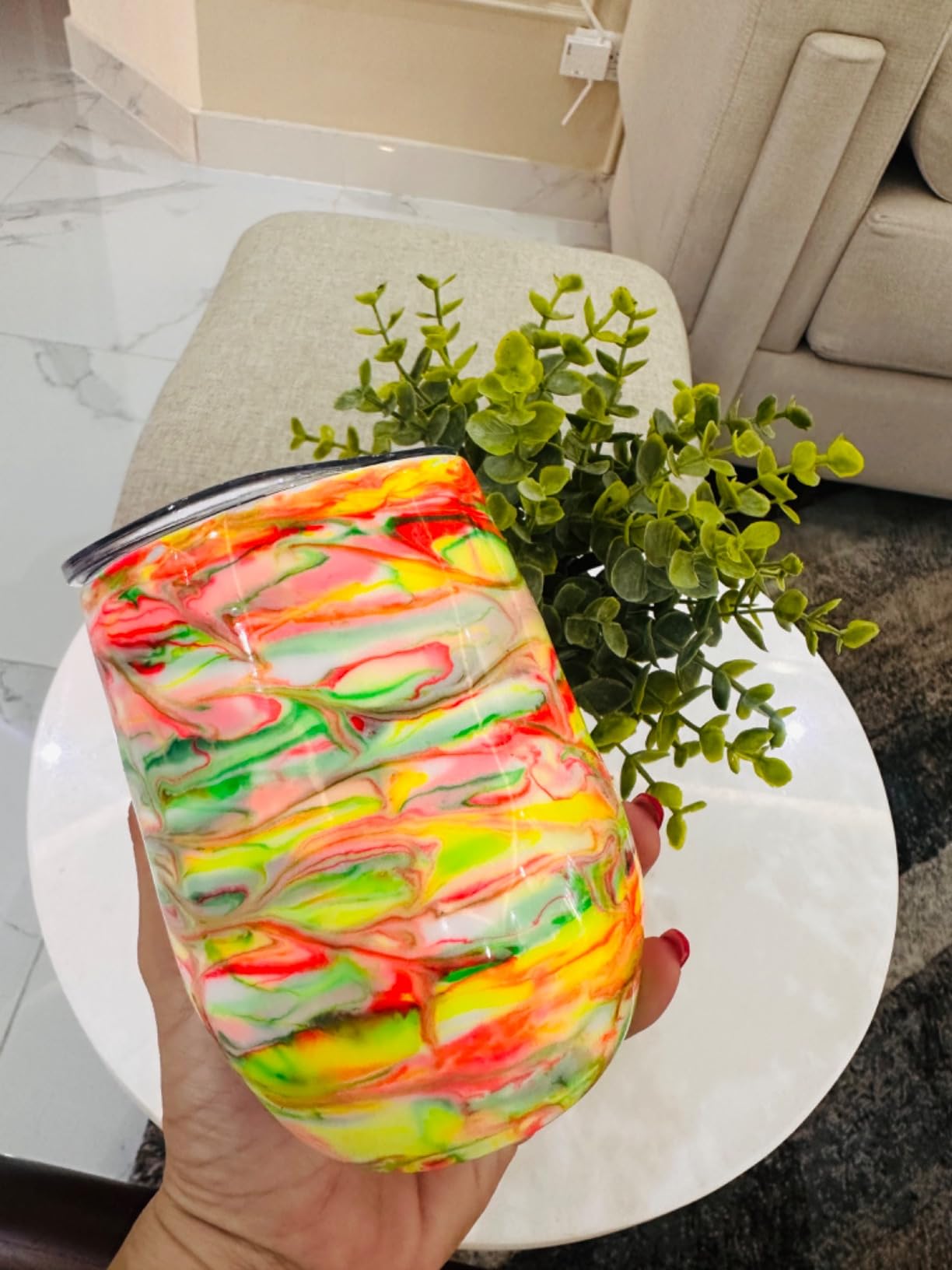 Finished insulated tumbler with a bright multicolor marbled wrap design